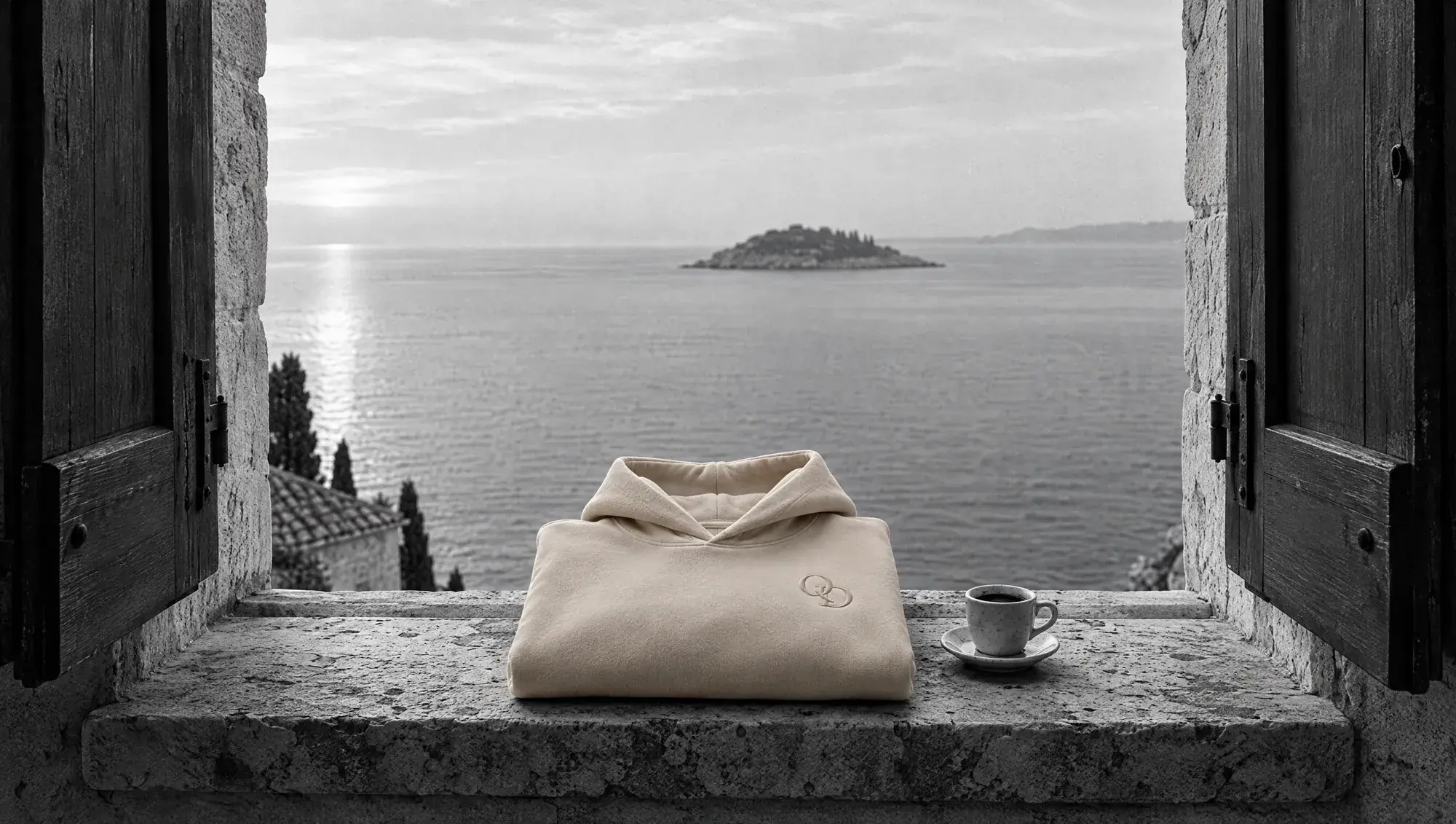 Q-01 folded on a stone window sill above the Adriatic sea
