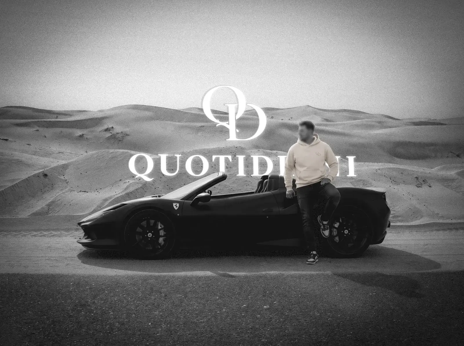 Q-01 worn by a black convertible in the desert